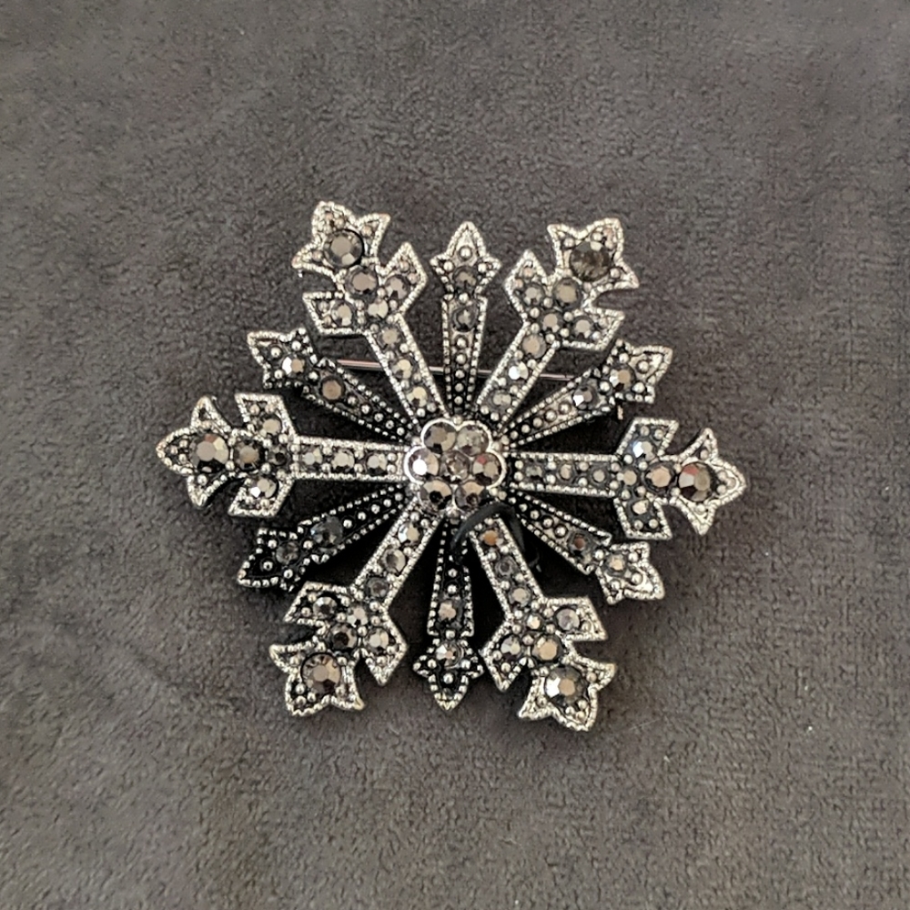 Used snowflake brooch